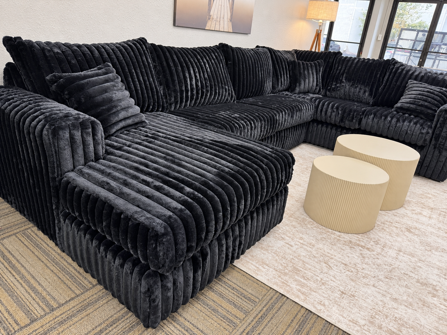 Charcoal corduroy sectional with a deep chaise on the left and a return on the right