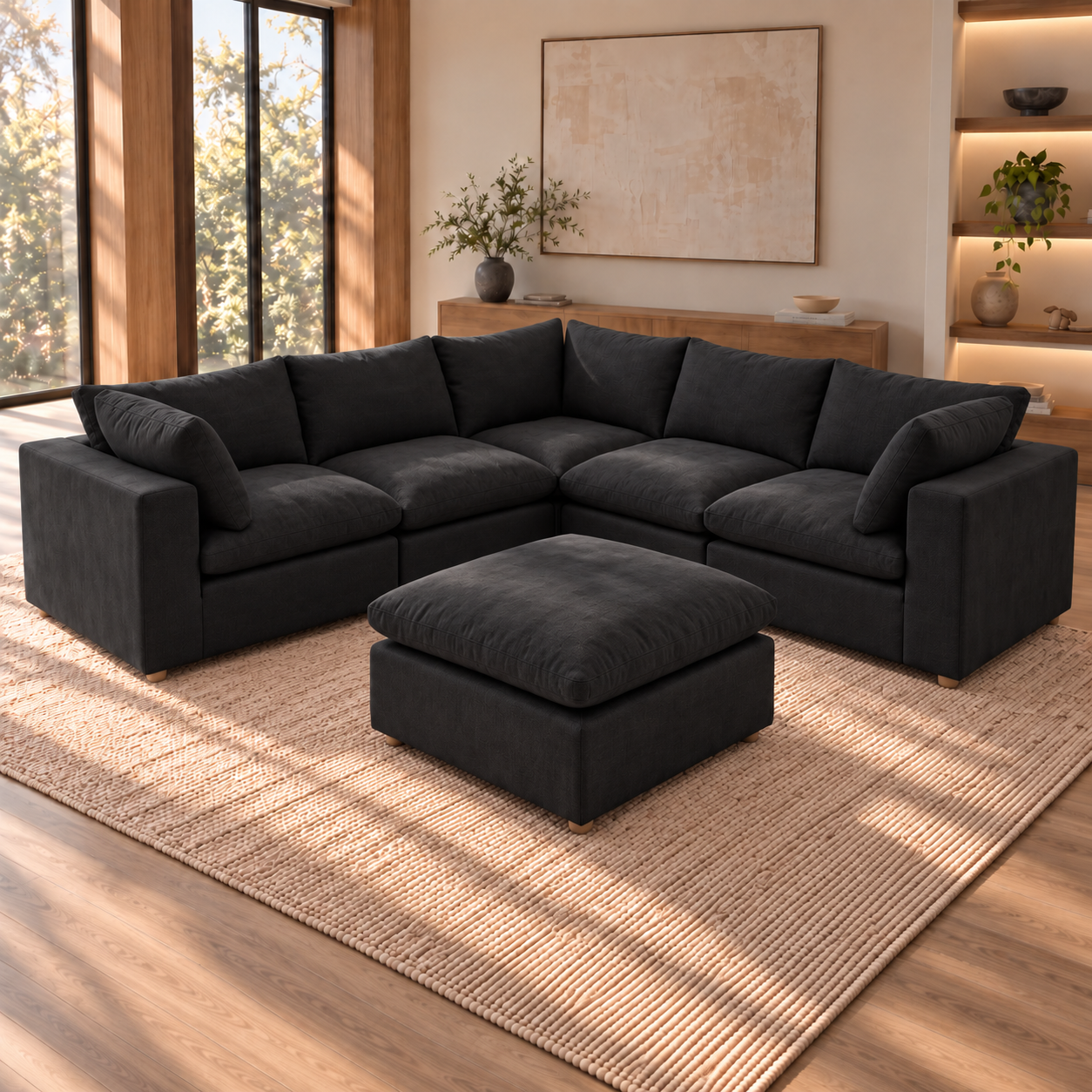 Norwick Black Down-Filled Cloud 5-Piece Sectional + Ottoman — Black five-piece sectional with matching ottoman, shown in a room.